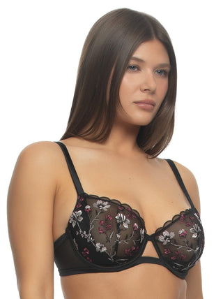 Victoria - A woman wearing an unlined embroidered bra in black with floral details - side view
