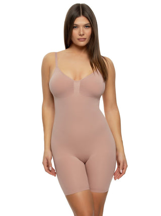 Victoria A woman wearing a beige short style seamless bodysuit.