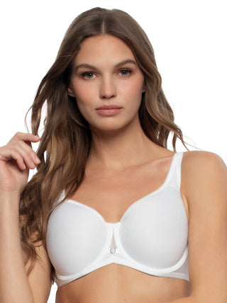 Daria - Woman wearing a white bra against a plain background