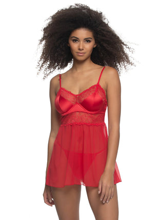 Birta Woman wearing a red lace nightgown against a white background