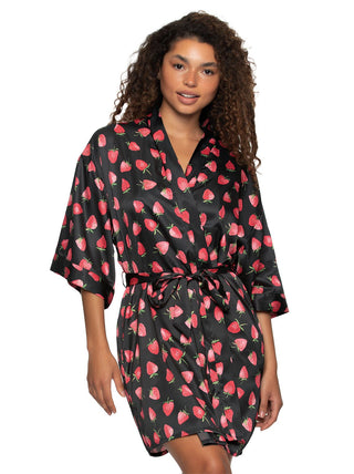 Quinn Woman wearing a black robe with red strawberry pattern on a white background