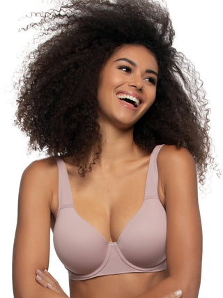 Birta - Woman wearing a light pink bra against a white background