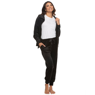 Woman wearing a black velvet zip-up hoodie open with white crew new tshirt underneath and matching pants on a white background