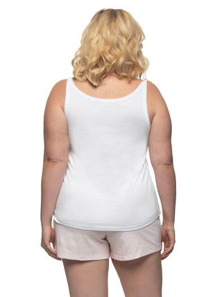 Full figure woman wearing white tank top and pink pajama shorts - back view