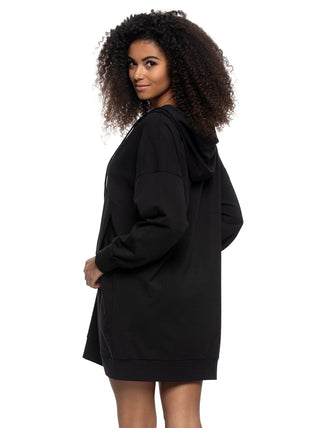 Woman wearing a black hoodie dress on a white background
