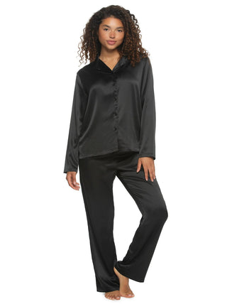 Quinn A woman modeling a black satin notch collar pajama set with a button-up long-sleeve top and wide-leg pants.