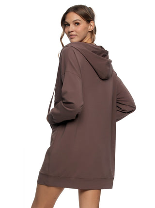 Woman wearing a brown hoodie sweatshirt dress on a white background