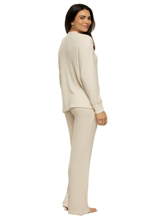 Woman wearing a beige outfit on a white background
