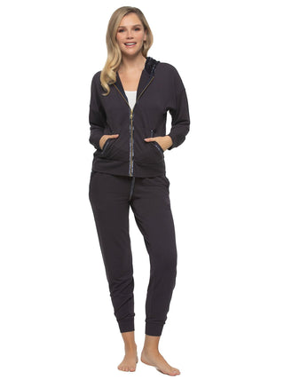 Masha A female model wearing a navy blue 2-piece lounge set with a zip-up hoodie and matching joggers.